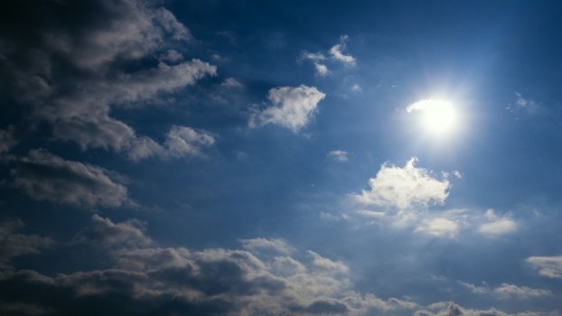 Timelapse sun and dark cloud