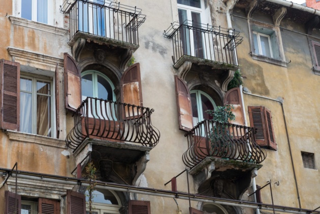 old verona facade old balcony with rust and moisture